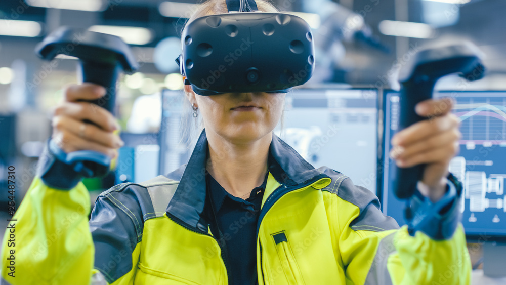 Leinwandbilder Portrait Female Mechanical Engineer Wearing Virtual Reality Headset and Using Controllers, She Uses VR technology for Industrial Design, Development and Prototyping in CAD Software. 