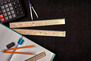 Mathematics education equipment tools.  Formula equation symbol printed on rulers. Study concept....