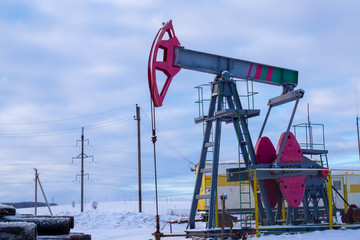 Oil and gas industry. Silhouette oil pumps on a sunset sky background.Oil industry equipment. Close up Industrial view at oil refinery plant form industry zone