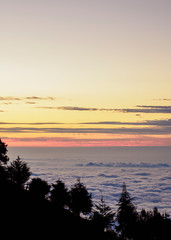 Fototapeta na wymiar Sunset over Sea of Clouds seen from the mountains of Guayas Province, Ecuador