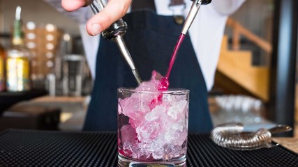 Bartender pouring cocktail