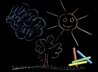 Colorful chalks and children's drawing of the sun and tree made with chalks isolated on black background