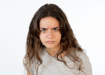 Fototapeta premium Human expressions and emotions. Portrait of young furious girl with angry face isolated on white