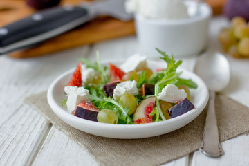 Beautiful vegetarian salad with goat cheese and figs.