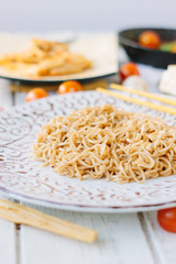 Ceramic plate filled by chinese rice noodles