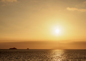 Naklejka na ściany i meble Sunset over Guy Fawkes Island, Galapagos, Ecuador