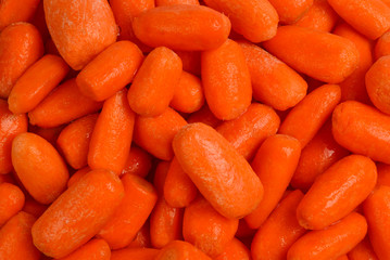 Little fresh carrots as a background. Snack.