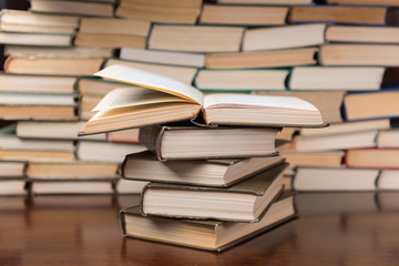 stack of books on the wooden table