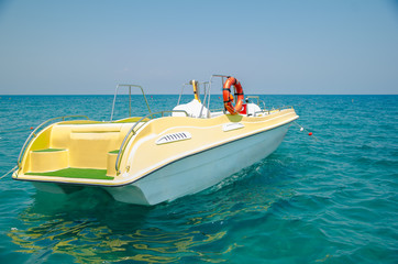 Yellow boat in the sea. Lifeboat. fishing on a yacht.