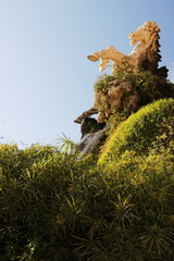 Ciutadella Park. A fountain with sculpture immersed in a papyrus mantle