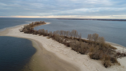 small island d in river with lot of bolds trees 