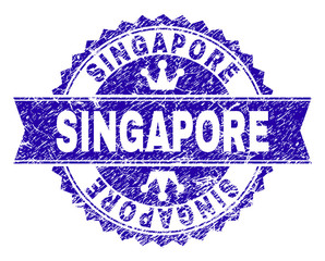 SINGAPORE rosette seal watermark with grunge effect. Designed with round rosette, ribbon and small crowns. Blue vector rubber watermark of SINGAPORE caption with grunge style.