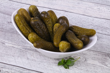 Pickled cucumbers heap in the bowl