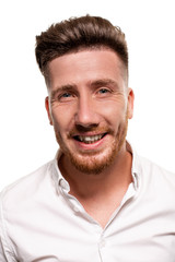 Fototapeta premium Studio photo of a good-looking man in a white shirt, isolated over a white background