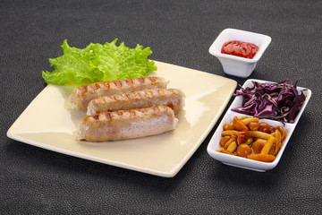 Grilled sausages served mushrooms and cabbage