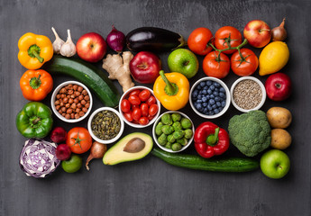 Healthy eating ingredients: fresh vegetables, fruits and superfood. Nutrition, diet, vegan food...