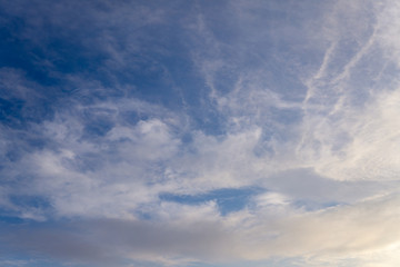 Fototapeta premium Blue sky with clouds and sun reflection in water with place for your text. blue sky background with white clouds