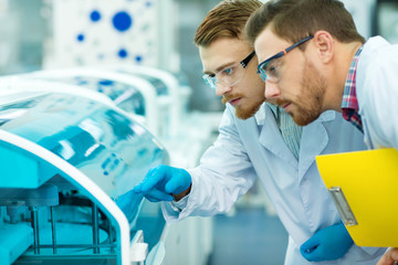 Two male scientists working at the laboratory