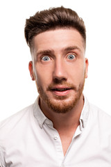 Fototapeta premium Studio photo of a good-looking man in a white shirt, isolated over a white background