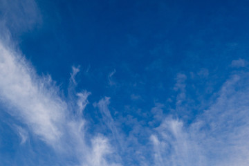 Obraz premium Blue sky with clouds and sun reflection in water with place for your text. blue sky background with white clouds