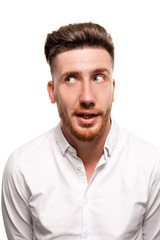Obraz premium Studio photo of a good-looking man in a white shirt, isolated over a white background