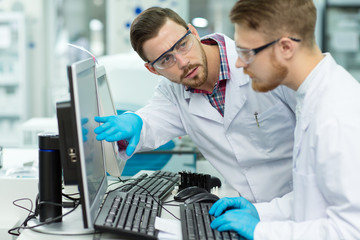 Two male scientists working at the laboratory