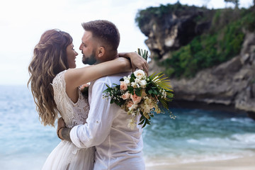 Portrait of Happy Couple, at the Beach, Holds Hands, Sea