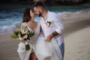 Portrait of Happy Couple, at the Beach, Holds Hands, Sea