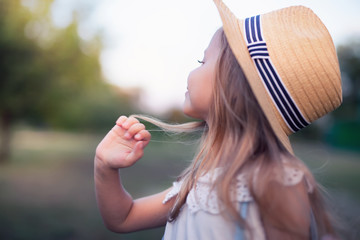 Summer outdoor portrait of beautiful happy child