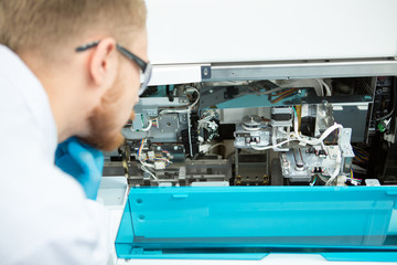 Male scientist working at the laboratory