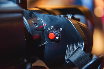 Red button on a large video camera. Video and photo equipment. On and off button on the video...