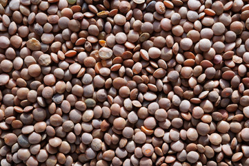 Heap of red lentil top view, background.