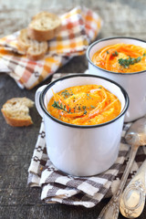 Vegetable carrot soup and bread, two portions