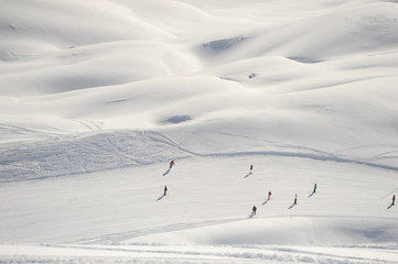 Skiing people in ski resort at winter