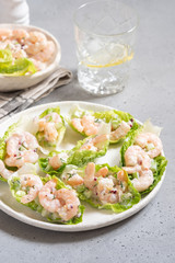 Shrimp salad wraps in lettuce leaves on a holiday table