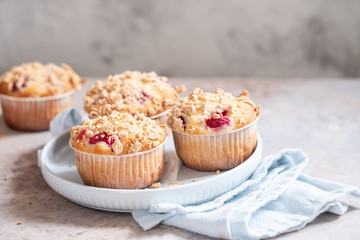 Fresh homemade delicious raspberry muffins on a table