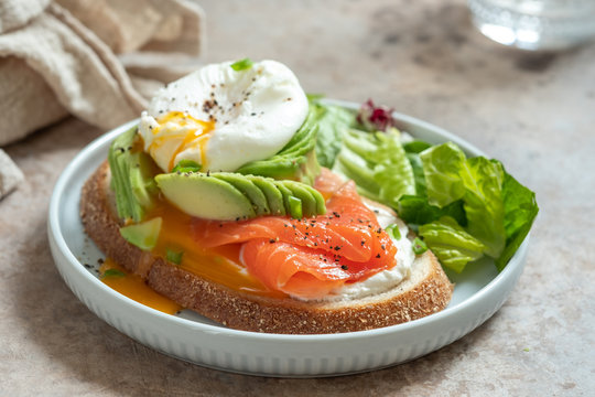 Salmon, avocado and poached egg sandwich, healthy eating