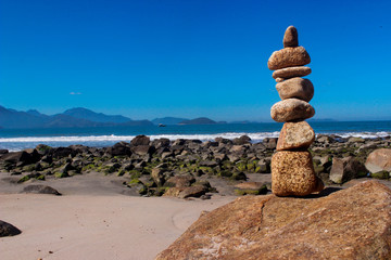 brown pile of stones near sea