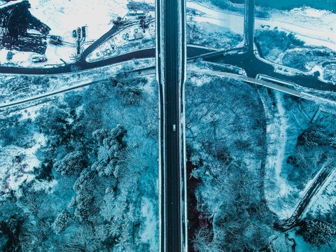 aerial photography of blue car on road
