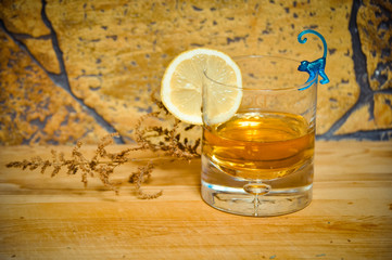 cognac whiskey in a glass Cup with lemon the concept of dinner, alcohol