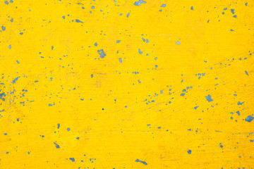 Old yellow color paint floor closeup for background.