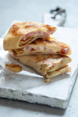 Fried Rolled Crepes with ham and cheese