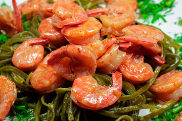 Shrimps with pasta and herbs. Home cooking.