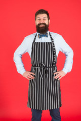 I will cook for you. Bearded man cook smiling in apron. Confident master cook with beard and...