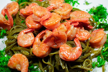 Shrimps with pasta and herbs. Home cooking.