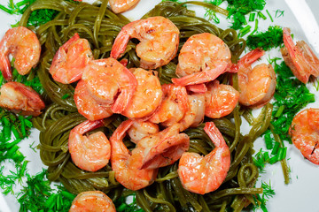 Shrimps with pasta and herbs. Home cooking.