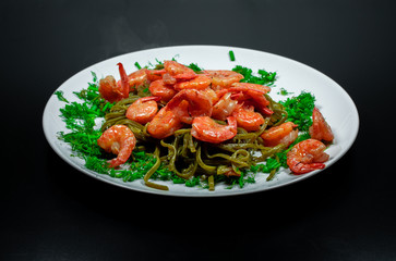 Shrimps with pasta and herbs. Home cooking.