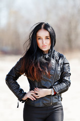 beautiful brunette in a leather jacket