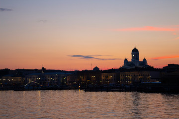 View of the embankment of Helsinki, houses and the silhouette of the Cathedral of St. Nicholas from...