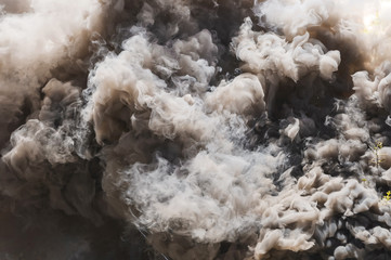 Pyrotechnic means for start-up smoke. Hand smoke grenade. Smoke bomb black. Gray smoke. The texture of the smoke. The area of the smoke. Fire. Pyrotechnics.